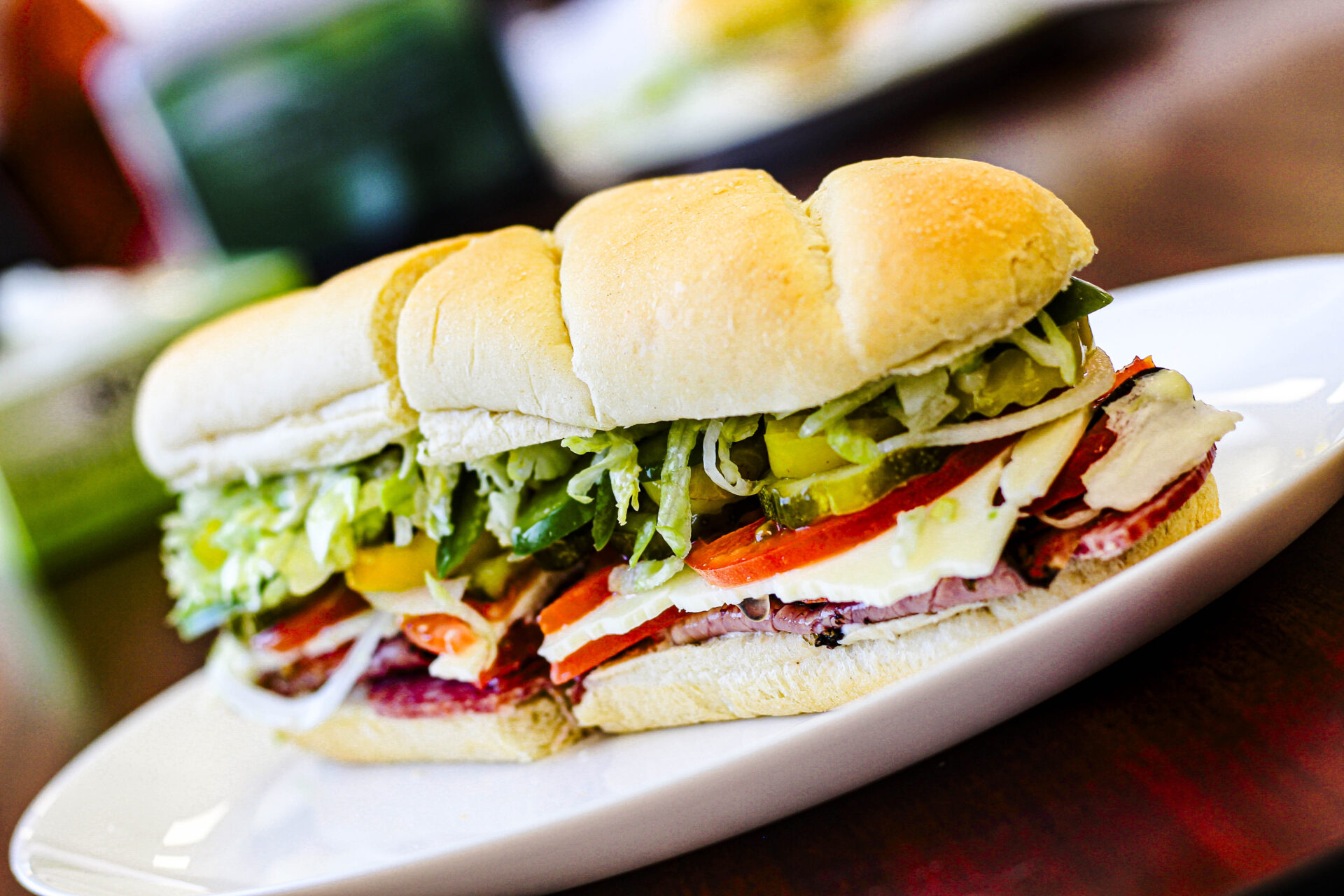 Sub with veggies, cheese, and roast beef